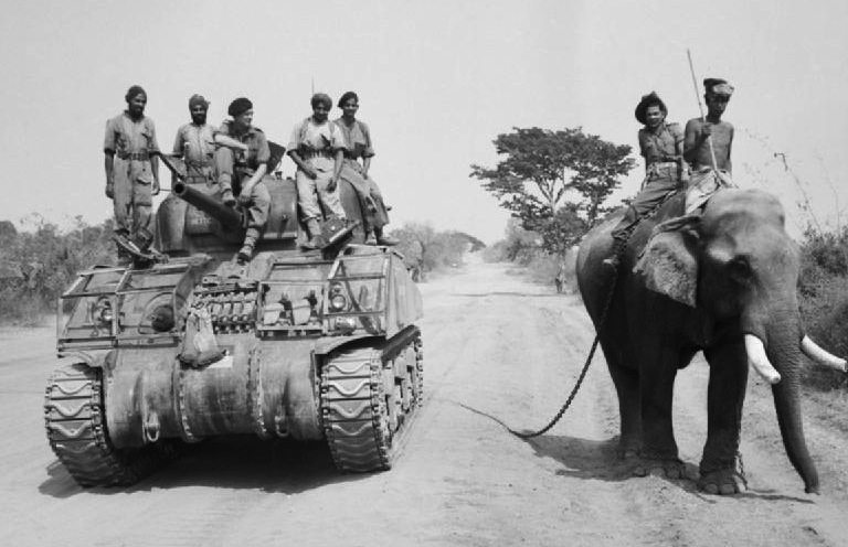 British_commander_and_Indian_crew_encounter_elephant_near_Meiktila