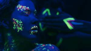 woman-with-fluorescent-make-up-face-hand